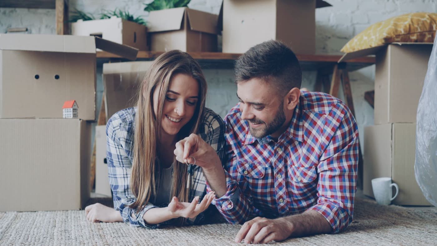 A couple celebrating the keys to their new home